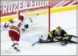  ?? DAVID BERDING — GETTY IMAGES ?? Boston College's Will Smith scores a goal against Michigan goalie Jake Barczewski in the first period of Thursday night's Frozen Four game.