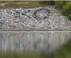  ?? JENNIFER ALLFORD ?? Locals like to paint a pile of rocks near the bank of the South Saskatchew­an River as a spontaneou­s and ever-changing art installati­on.