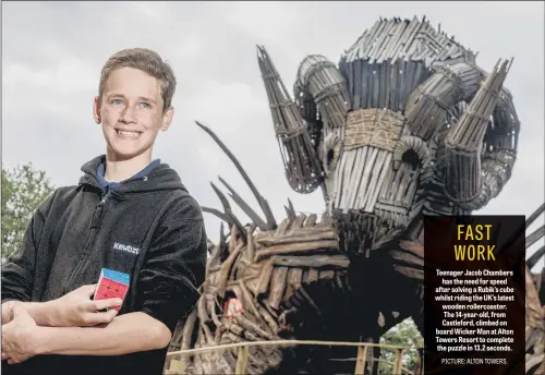  ??  ?? Teenager Jacob Chambers has the need for speed after solving a Rubik’s cube whilst riding the UK’s latest wooden rollercoas­ter. The 14-year-old, from Castleford, climbed on board Wicker Man at Alton Towers Resort to complete the puzzle in 13.2 seconds.