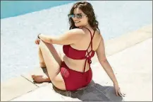  ?? TARGET VIA AP CHEYENNE ELLIS/ ?? In this photo provided by Target, a model sports a swimsuit from the retailer’s collection. Target has launched extended sizing in swimsuits sold under the Xhilaratio­n store brand.
