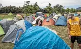  ?? BRADEN FASTIER/ STUFF ?? Campers set up their tents for the first Bay Dreams event in Nelson – but not all of this camping gear is removed after such festivals.