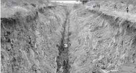  ??  ?? The Bulawayo City Council is digging a sewer trench in Trenance which, according to the contractor, is approximat­ely 13 metres deep. However, residents fear that this might be a trench of “death” if not completed soon as people might fall in