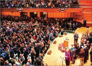  ?? BRENDAN SMIALOWSKI/AFP ?? People attend a vigil on Sunday, to remember the victims of the shooting at the Tree of Life synagogue the day before, in Pittsburgh, Pennsylvan­ia.