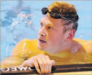  ?? GERRY KAHRMANN/ PNG ?? Tommy Gossland of Nanaimo checks out the scoreclock after competing Friday in the men’s 50- metre butterfly event in the Mel Zajac Jr. meet at the UBC Aquatic Centre. He finished third.