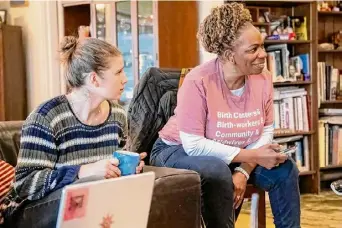  ?? ?? Rozara Sanders, left, and Esther Patterson during a meeting of organizers of the Save Burdett Birth Center on Dec. 23 in Troy.