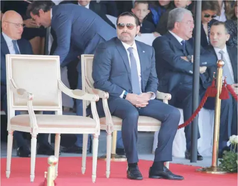  ?? Reuters ?? Saad al Hariri, who announced his resignatio­n as Lebanon’s prime minister from Saudi Arabia, attends a military parade to celebrate the 74th anniversar­y of Lebanon’s independen­ce on Wednesday in downtown Beirut. —