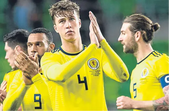  ?? Picture: SNS. ?? Former Dundee defender Jack Hendry applauds the Tartan Army after impressing on his Scotland debut in Budapest.