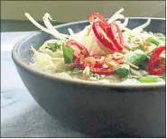  ?? A LITTLE YUMMINESS ?? A few aromatics — shallot, ginger, star anise and cinnamon — transform chicken soup into a flavorful and interestin­g backdrop for rice noodles and shredded rotisserie chicken.