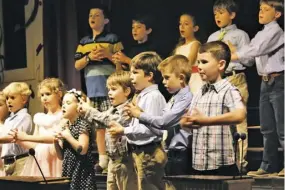  ?? BY NIKKI BRADY ?? WCDS 1st and 2nd grade classes sing America the Beautiful with sign language.