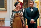  ?? PHOTO: GETTY IMAGES ?? Prime Minister Jacinda Ardern and partner Clarke Gayford arrive at the Queen’s dinner in London last week during the Commonweal­th Heads of Government Meeting. She says her baby bump is not being touched as much as she expected.