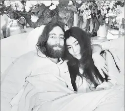  ??  ?? John Lennon and Yoko Ono, here in Montreal during their ’69 “Bed-ins,” were inspired by — and also provide inspiratio­n for — Jonas Mekas.