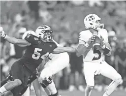  ??  ?? ASU’s Case Hatch (54) pressures Sacramento State quarterbac­k Kevin Thomson during a game at Sun Devil Stadium on Sept. 6.