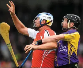  ?? SPORTSFILE ?? Former Ireland striker Niall Quinn, representi­ng Davy Russell’s Best, is tackled by Kilkenny legend JJ Delaney, representi­ng Jim Bolger’s Stars, during the seventh annual Hurling for Cancer Research game in Newbridge