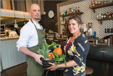  ??  ?? Aurelien Mourez, of Ox and Finch, with his mystery box of veg delivered by Abi Mordin, chair of Glasgow Community Food Network