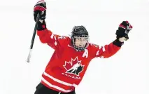  ?? C L AU D I O B R E S C I A NI / A F P/ G E T T Y I MAGES ?? Courtney Birchard celebrates scoring at the women’s world hockey championsh­ip Sunday in Malmo, Sweden.