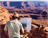  ??  ?? An artist paints a plein air work in Moab, Utah.