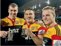  ?? GETTY IMAGES ?? Sonny Bill Williams has tasted a breadth of success like few other sportspeop­le: He was an NRL winner with the Roosters in 2013, pictured, and the Bulldogs in 2004; he was twice part of Rugby World Cup winning teams with the All Blacks and, above, celebrates the Chiefs’ 2012 Super Rugby success with Brodie Retallick and Sam Cane.