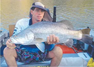  ?? Rod Heathcote worked hard to find this 82cm barra on season opening day. ??
