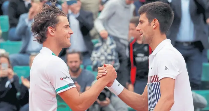  ?? Gonzalo fuentes / reuters ?? El saludo entre Thiem y djokovic tras la victoria del austríaco por 7-6 (7-5), 6-3 y 6-0; mañana se medirá con nadal