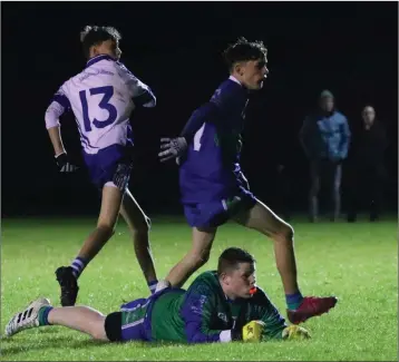  ??  ?? Aughrim’s Conaill O’Brien wheels away after scoring a goal againdst AGB.