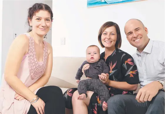  ??  ?? Profession­al doula Moran Liviani with Alicia and Damien Cooke, who she helped in the lead-up to the birth of son, Finn. Picture: RICHARD GOSLING