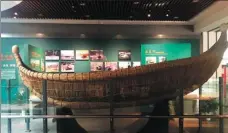  ??  ?? A large boat made of reeds is one of the exhibits at the museum.