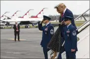  ?? AP ?? President Donald Trump, accompanie­d by first lady Melania Trump, arrives to the Daytona 500. Trump is the grand marshal for the race, meaning he will give the command for drivers to start their engines.