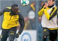  ?? AP ?? Usain Bolt ( left) heads the ball towards Dortmund Under-19’s Tim Sechelmann during a practice session in Dortmund in March. —