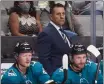  ?? NHAT V. MEYER — BAY AREA NEWS GROUP ?? Sharks head coach Bob Boughner watches a game from the bench against the Kings last year.