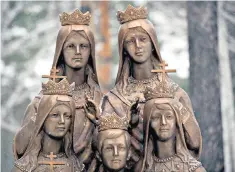  ??  ?? A monument to Tsar Nicholas II’S children at the Ganina Yama monastery, Yekaterinb­urg