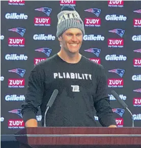  ?? HERALD PHOTO BY JEFF HOWE ?? MESSAGE FOR THE MEDIA: Tom Brady wears a ‘Pliability’ shirt as he answers questions at the podium yesterday at Gillette Stadium.