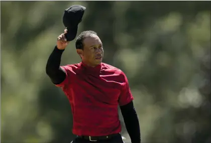  ?? JAE C. HONG — THE ASSOCIATED PRESS ?? Tiger Woods tips his cap on the 18th green during the final round at the Masters golf tournament. Woods hasn’t said whether he’ll play in the PGA Championsh­ip next week at Southern Hills.