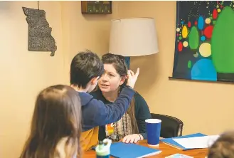  ?? NEETA SATAM FOR THE WASHINGTON POST ?? Rabbi Karen Bogard talks to her 9-year-old son, who is transgende­r and came out as a boy a few years ago, during their visit to the Missouri Capitol in Jefferson City last month.