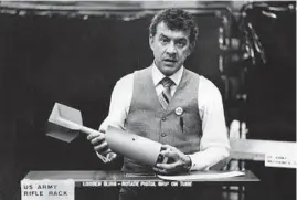  ?? OVIE CARTER/CHICAGO TRIBUNE ?? Nelson Carlo, then-president of Abbott Products Inc. at 3303 S. Lawndale Ave., holds a practice bomb for the U.S. military on Aug. 14, 1980.