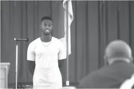  ?? Staff photo by Jerry Habraken ?? ■ Local track and field athlete Jarrion Lawson, who competed in the 2016 Olympic Games, speaks after being awarded the Daniel E. Haskins Educationa­l Scholarshi­p Saturday during the 13th annual Macedonia-Eylau Community in Action Day in the Park.