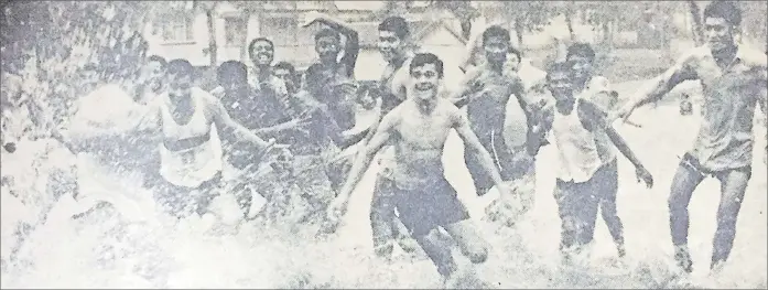  ?? Picture: FILE ?? Boys enjoy a game of rugby during the heavy downpour in November, 1970.