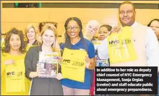  ?? ?? In addition to her role as deputy chief counsel of NYC Emergency Management, Sonja Orgias (center) and staff educate public about emergency preparedne­ss.