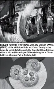  ??  ?? DANCERS PERFORM TRADITIONA­L LION AND DRAGON DANCES (ABOVE) at the MGM Grand Hotel and Casino Tuesday in Las Vegas. An undated photo provided by Disneyland Resort (below) shows a Mickey Mouse-shaped Chinese hot dog bun at Disney California Adventure Park in Anaheim, Calif.