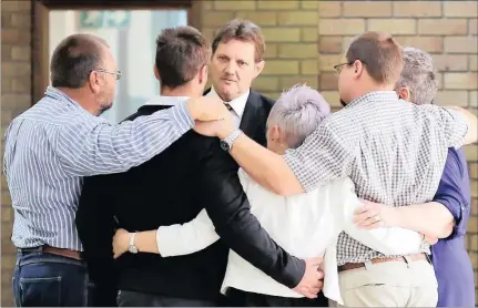  ??  ?? FAMILY TIME: Henco Boshoff with his family after the sentence was handed down. Danie van der Lith