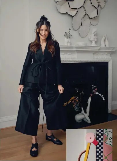  ??  ?? Anissa Kermiche in her living-room, wearing wool and silk jacket, matching trousers, lamb-skin flats, all from Dior. Jewellery throughout, her own