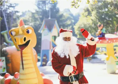  ?? Lea Suzuki / The Chronicle ?? Eric Martin (top) will be Santa in Fairy Winterland, which runs through Dec. 23. He takes over from Ron Zeno, who died in June after two decades as the Fairyland Santa.