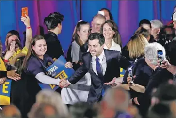  ?? Charlie Neibergall Associated Press ?? PETE BUTTIGIEG campaigns in Indianola, Iowa, last week. Who knew the 37-year-old gay mayor of a small Midwest city would outlast Kamala Harris and Beto O’Rourke and poll better than most of his rivals?
