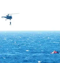  ?? AFP ?? an Indian Navy helicopter rescue sailors from the cargo vessel;