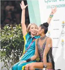  ?? Picture: GETTY IMAGES ?? Aussie Enid Sung and her coach Daniellie Le Ray wait for gymnastics scores to drop.