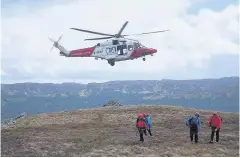  ??  ?? Rescue teams from Killin and Lomond MRTs helped by air support