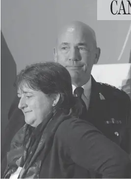  ?? ADRIAN WYLD / THE CANADIAN PRESS ?? RCMP commission­er Bob Paulson with lead plaintiff Janet Merlo. Paulson apologized Thursday to all current and former female officers and employees who suffered bullying, discrimina­tion and harassment during their time on the force.