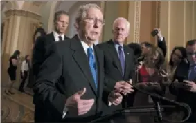  ?? J. SCOTT APPLEWHITE — THE ASSOCIATED PRESS ?? Senate Majority Leader Mitch McConnell, R-Ky., flanked by Sen. John Thune, R-S.D., left, and Senate Majority Whip John Cornyn, R-Texas, speaks with reporters Tuesday at the Capitol in Washington following weekly policy luncheons, where they discussed...