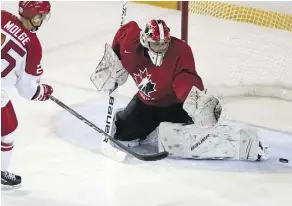  ?? PETER POWER/THE CANADIAN PRESS ?? Michael DiPietro, making a save against Denmark’s Magnus Molge during exhibition play Friday in St. Catharines, Ont., was the biggest omission when Canada announced its roster.