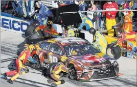  ?? David Graham The Associated Press ?? Las Vegas native Kyle Busch pits during the Daytona 500 on Sunday. Busch, seeking his first 500 title, finished as runner-up to Joe Gibbs Racing teammate Denny Hamlin.