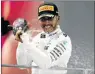  ?? Picture: GETTY IMAGES ?? IN THE DRIVING SEAT: Lewis Hamilton of Great Britain and Mercedes GP celebrates winning the Singapore Grand Prix at Marina Bay Street Circuit yesterday